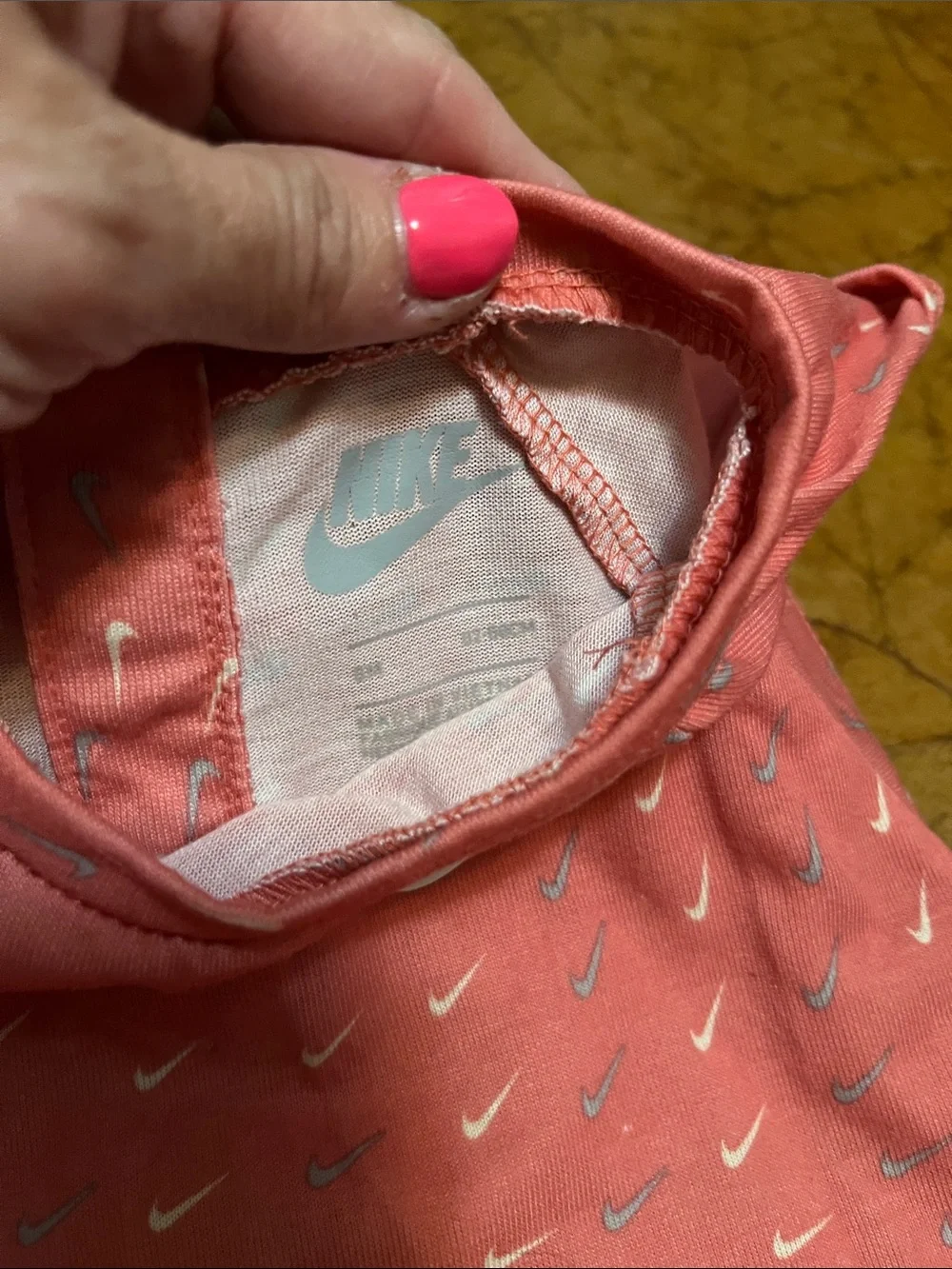 Nike Coral Pink Baby Romper with Repeat Swoosh Print